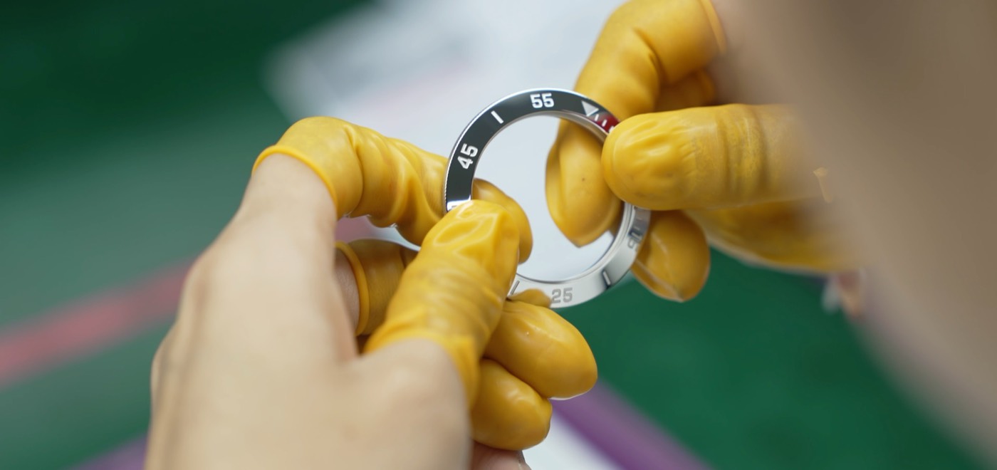 Inspector checking a coated watch bezel